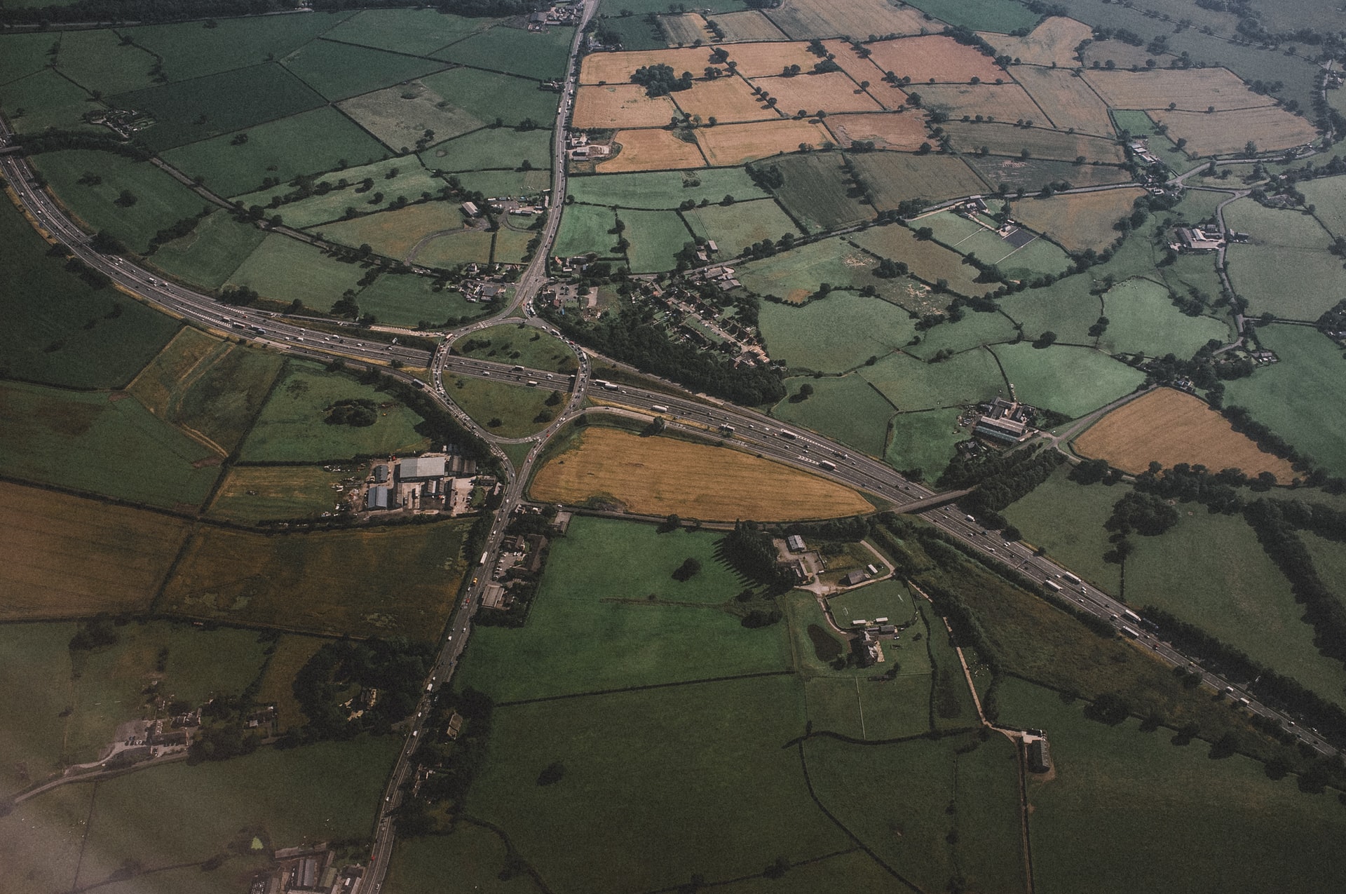 Aerial view of fields and a highway